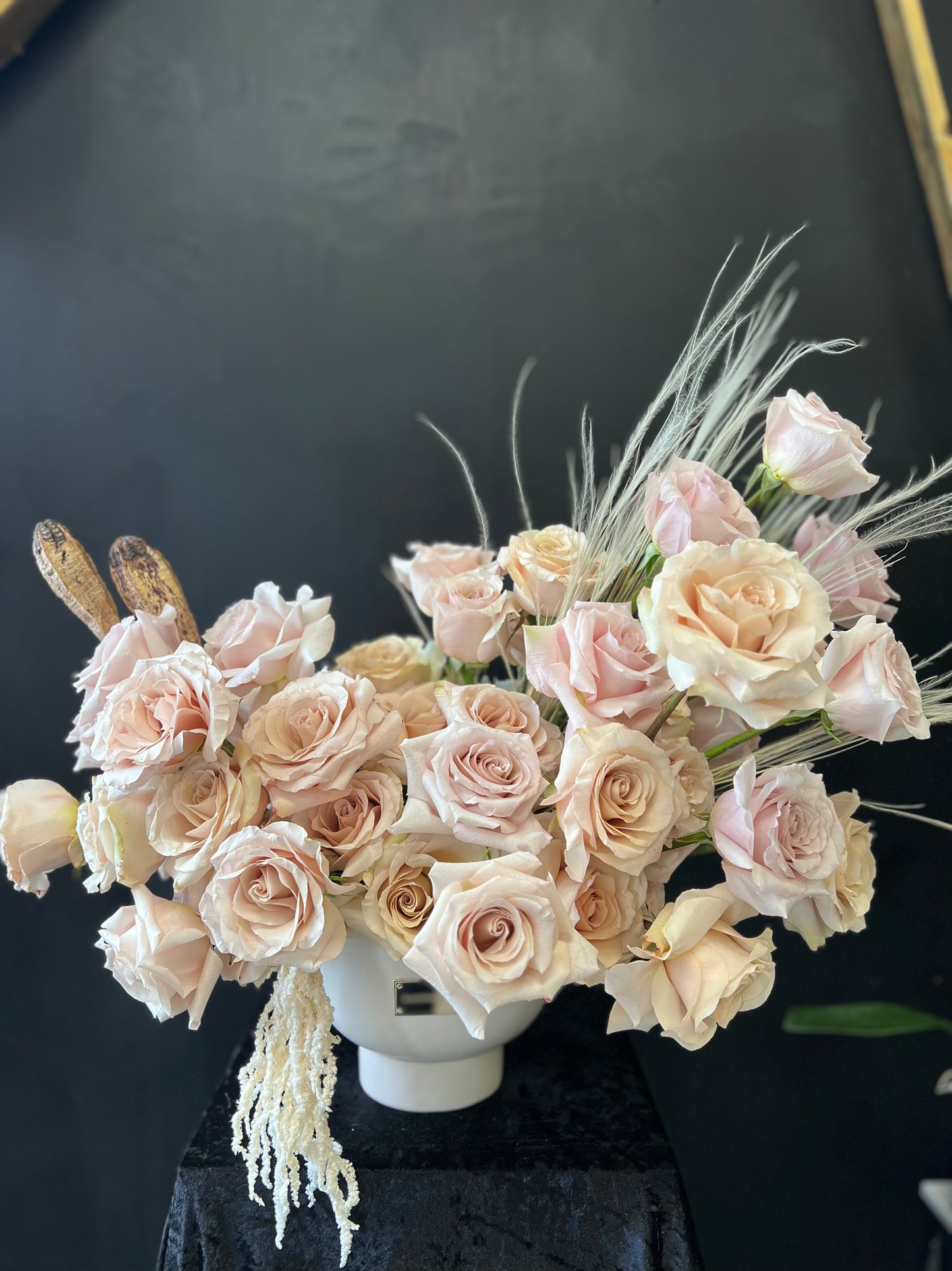 White vase with abstract nude rose