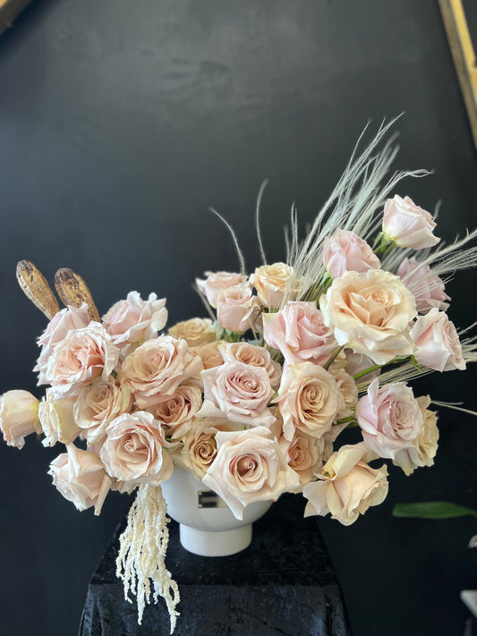 White vase with abstract nude rose