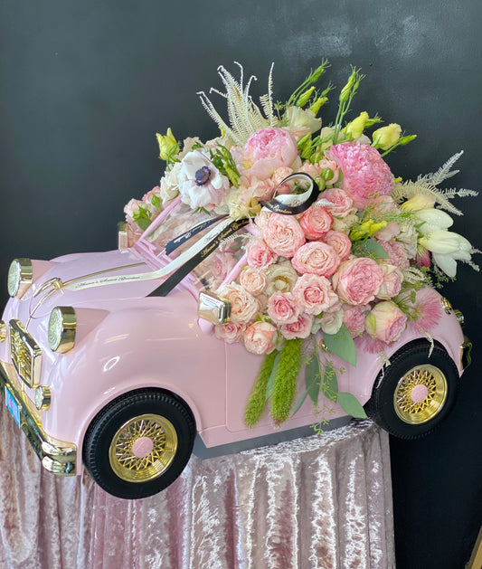 A Pink Car Full of Flowers