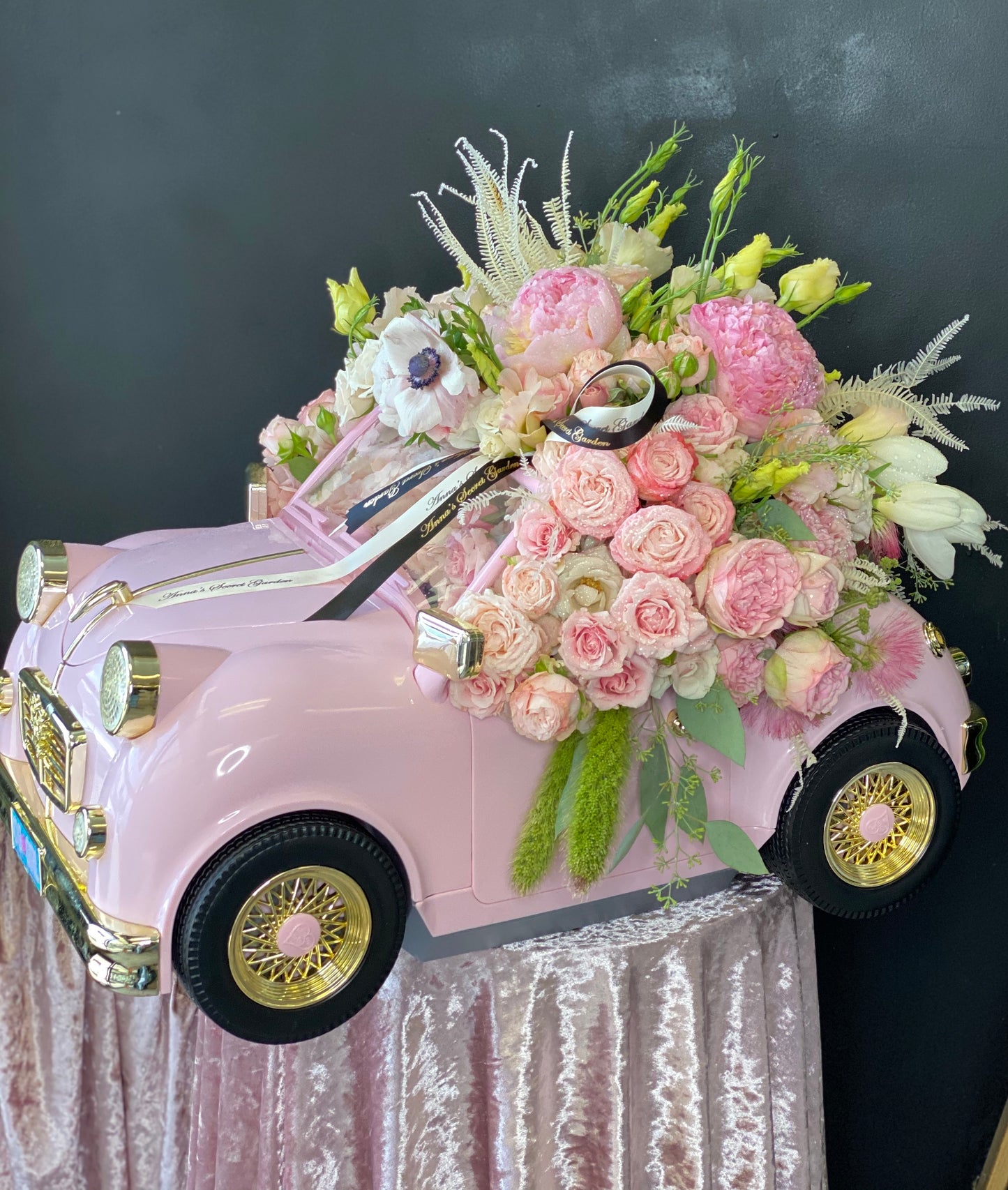 A Pink Car Full of Flowers