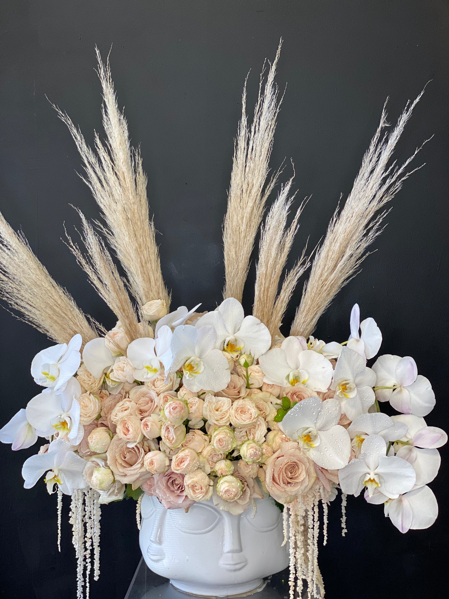 Nude Roses and White Orchids in Round Face Vase